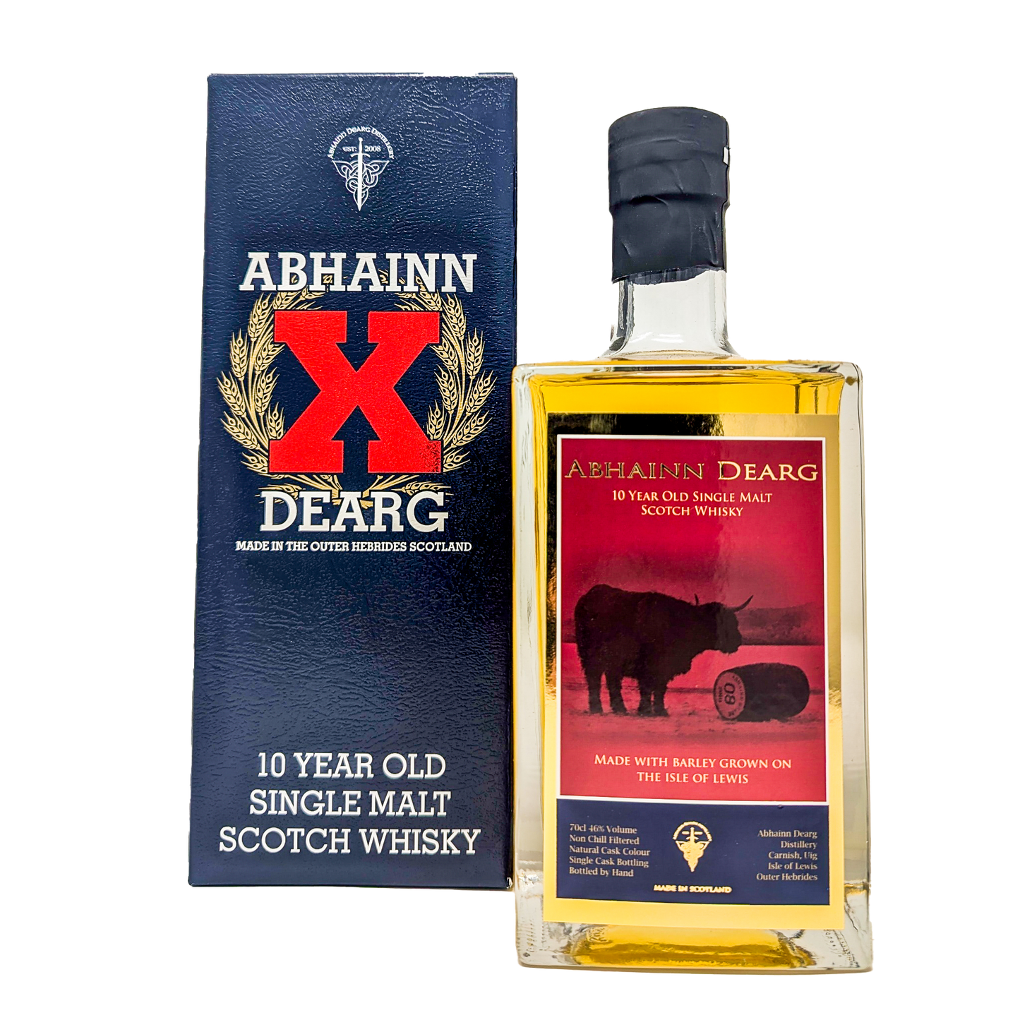 A bottle of the Abhainn Dearg 10 year old single malt whisky with its red and gold label with the highland cow and a cask of abhainn dearg beside the navy blue carton with the big bright red X on it