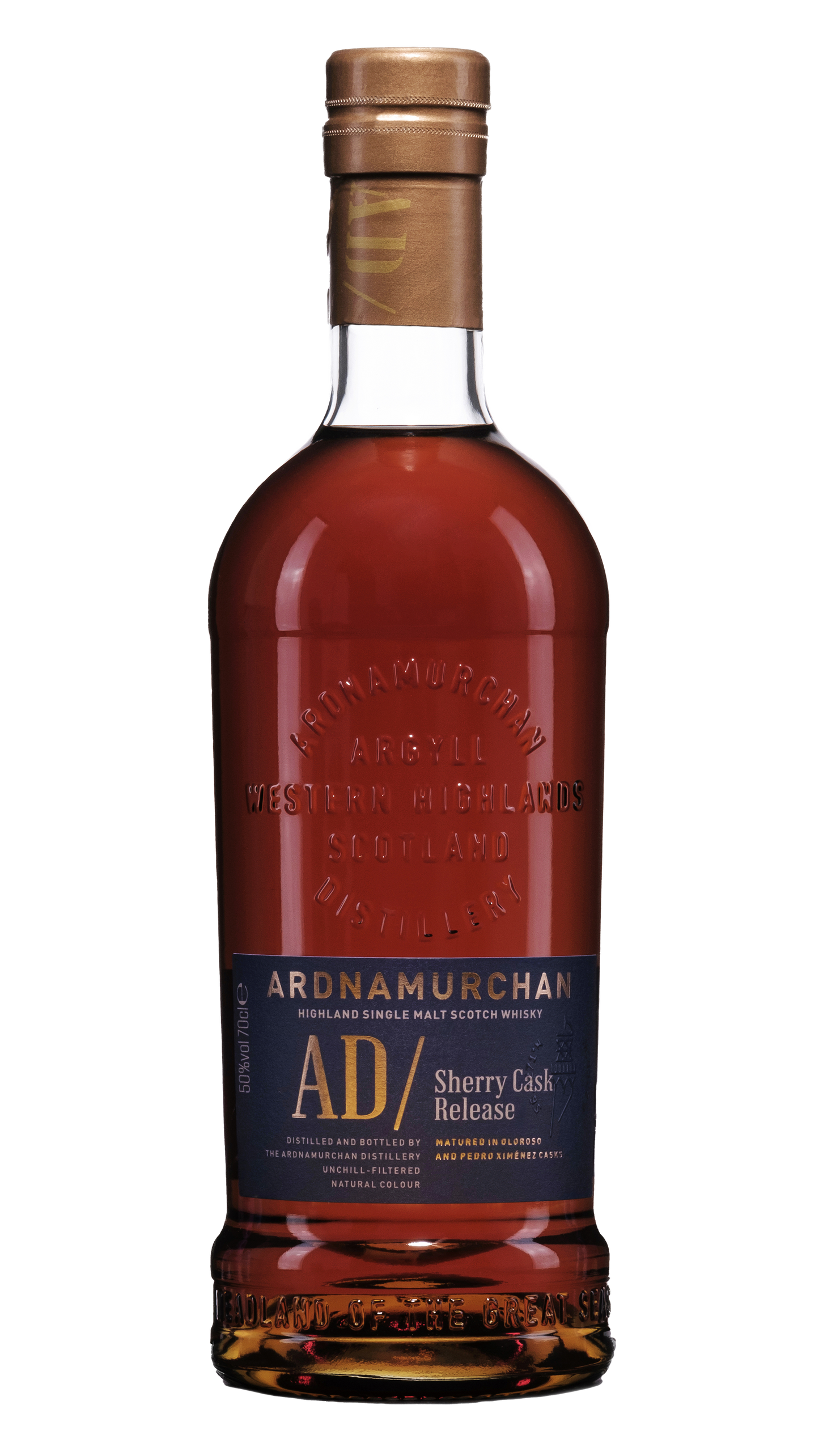 A bottle of Ardnamurchan Sherry release single malt dark red whisky in a bottle embossed with the adrnamurchan logo and a navy blue label with gold writing