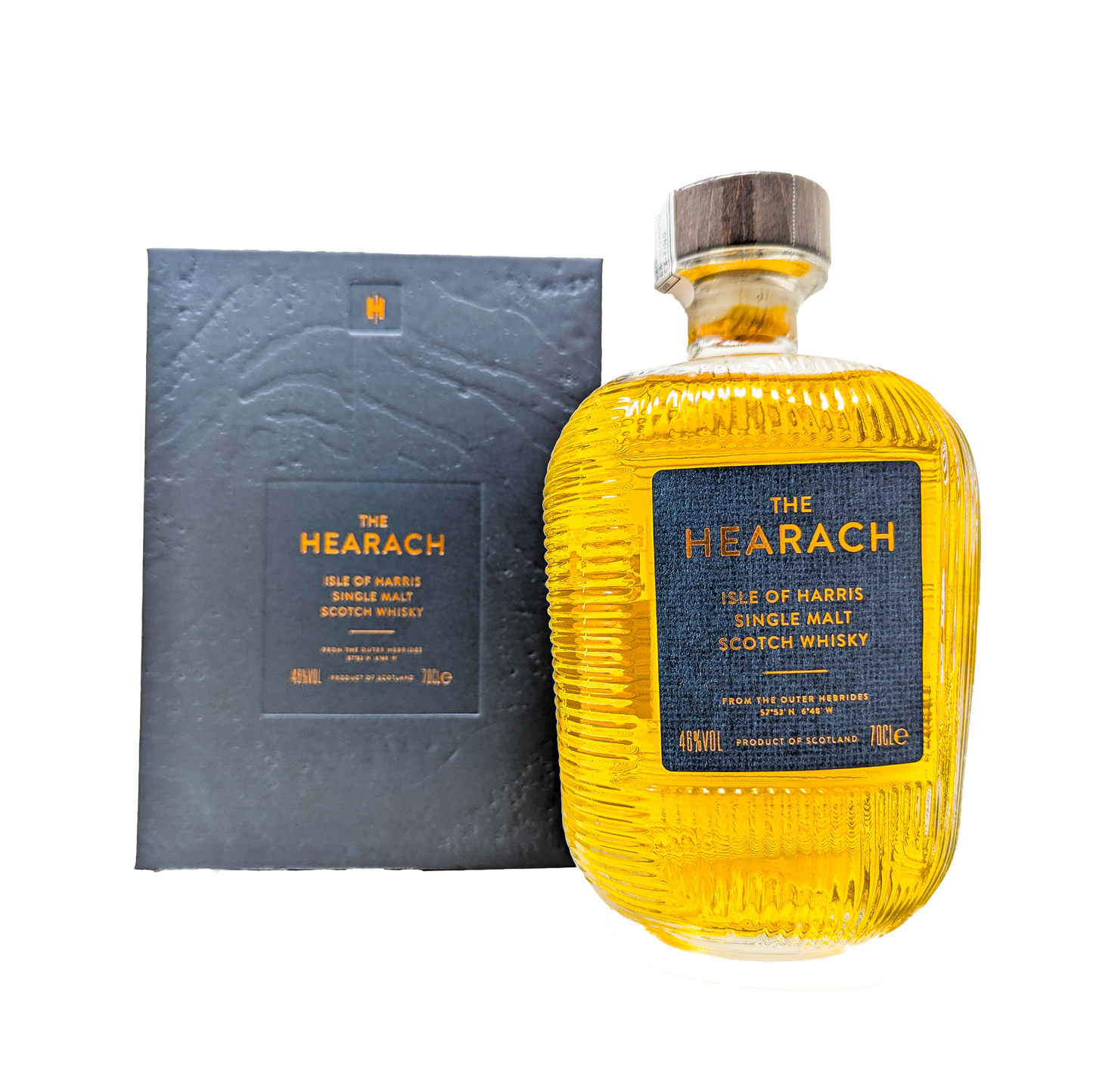 A bottle of the original hearach single malt whisky from the isle of harris distillery with a grey hearach box in the back ground.