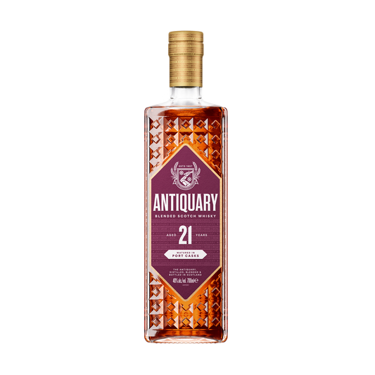 A bottle of the Antiquary 21 year old port cask blended whisky with its purple label and diamond indents on the bottle dark red whisky 