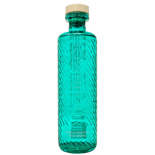 Bottle of downpours coast & croft original gin from the north uist distillery in its teal green bottle 