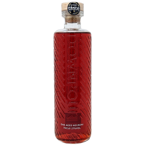 Bottle of downpours oak aged negroni pre mixed gin cocktail from the north uist distillery in its clear bottle and red liquid