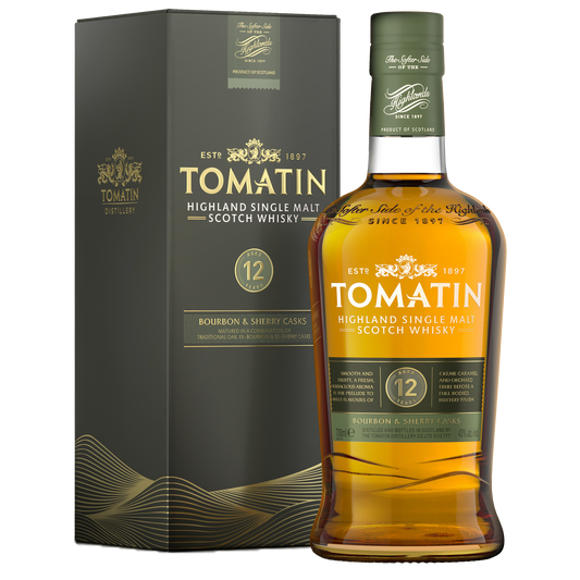 A bottle of tomatin 12 single malt whisky with its dark green label and gold writing filled with amber whisky beside its dark green carton with gold writing. 