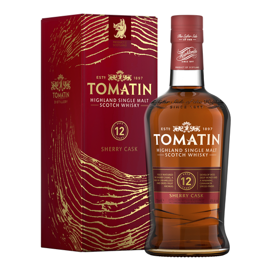 A bottle of tomatin 12 sherry cask release single malt whisky beside its red carton with gold wood ring marks on it dark red whisky