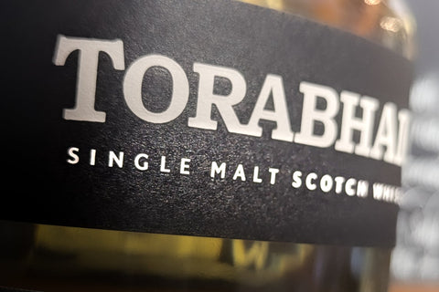 Close-up of a Torabhaig single malt Scotch whisky bottle label.