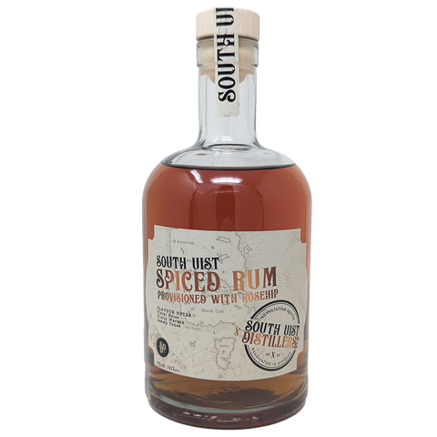 Bottle of South Uist Rose Hip Spiced Rum from the South Uist Distillery. Label shows the South Uist Distillery branding with Spiced Rum Infused with Rose Hip written with a light map of the South Uist Island. 