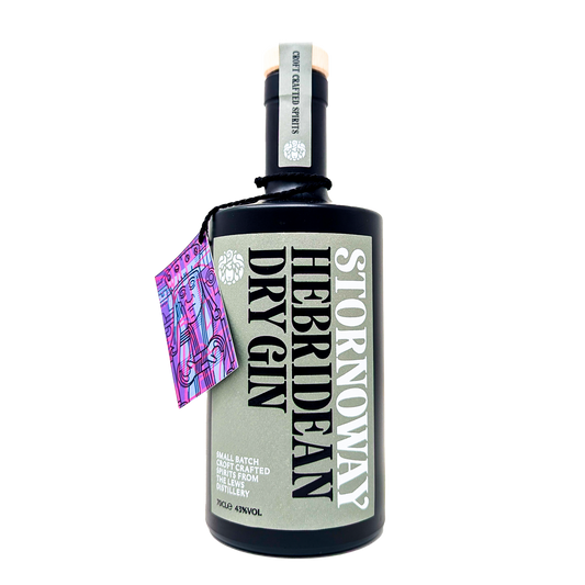 A bottle of stornoway hebridean dry gin from the lews distillery, black bottle with a grey label and a purple tag with a lewis chessman.